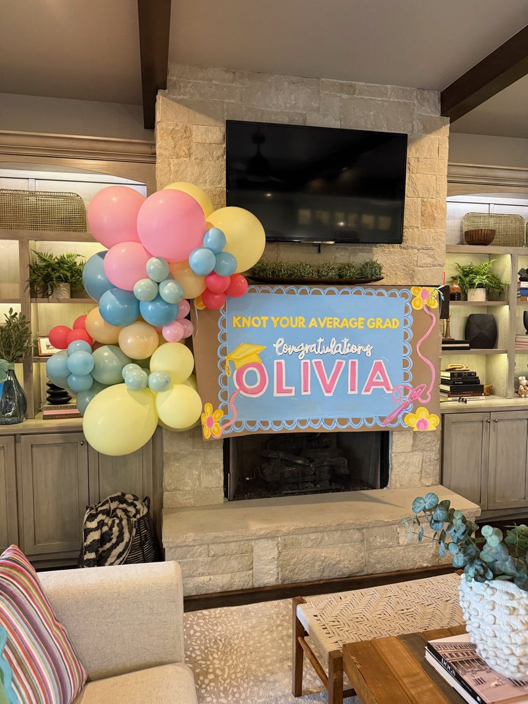 Graduation banner styled with a balloon garland