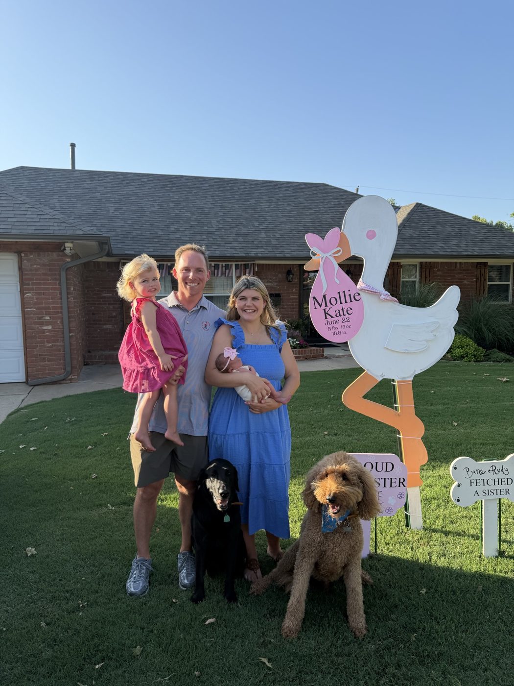 Family with their stork yard sign rental